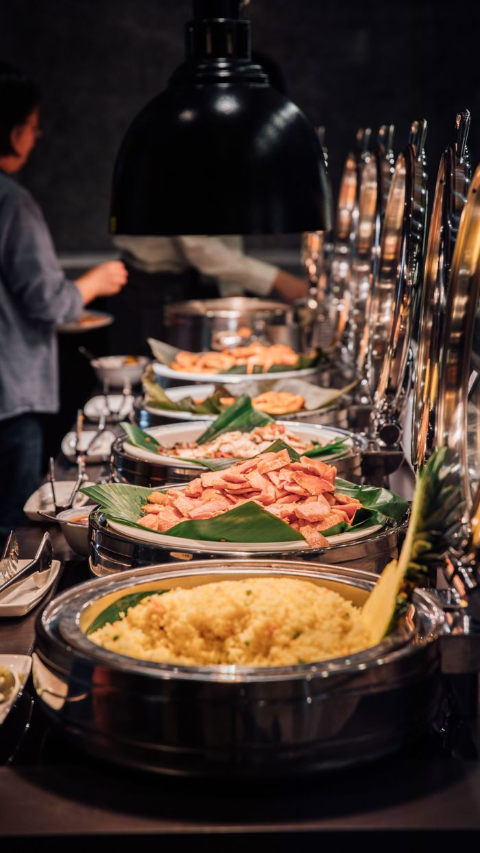 Mastering the First Impression: Your intriguing post title goes here A lavish buffet setup showcasing an array of gourmet dishes elegantly arranged.