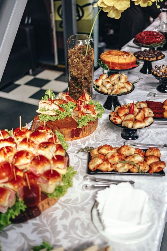 A lavish buffet table adorned with a variety of baked goods and snacks, perfect for events.
